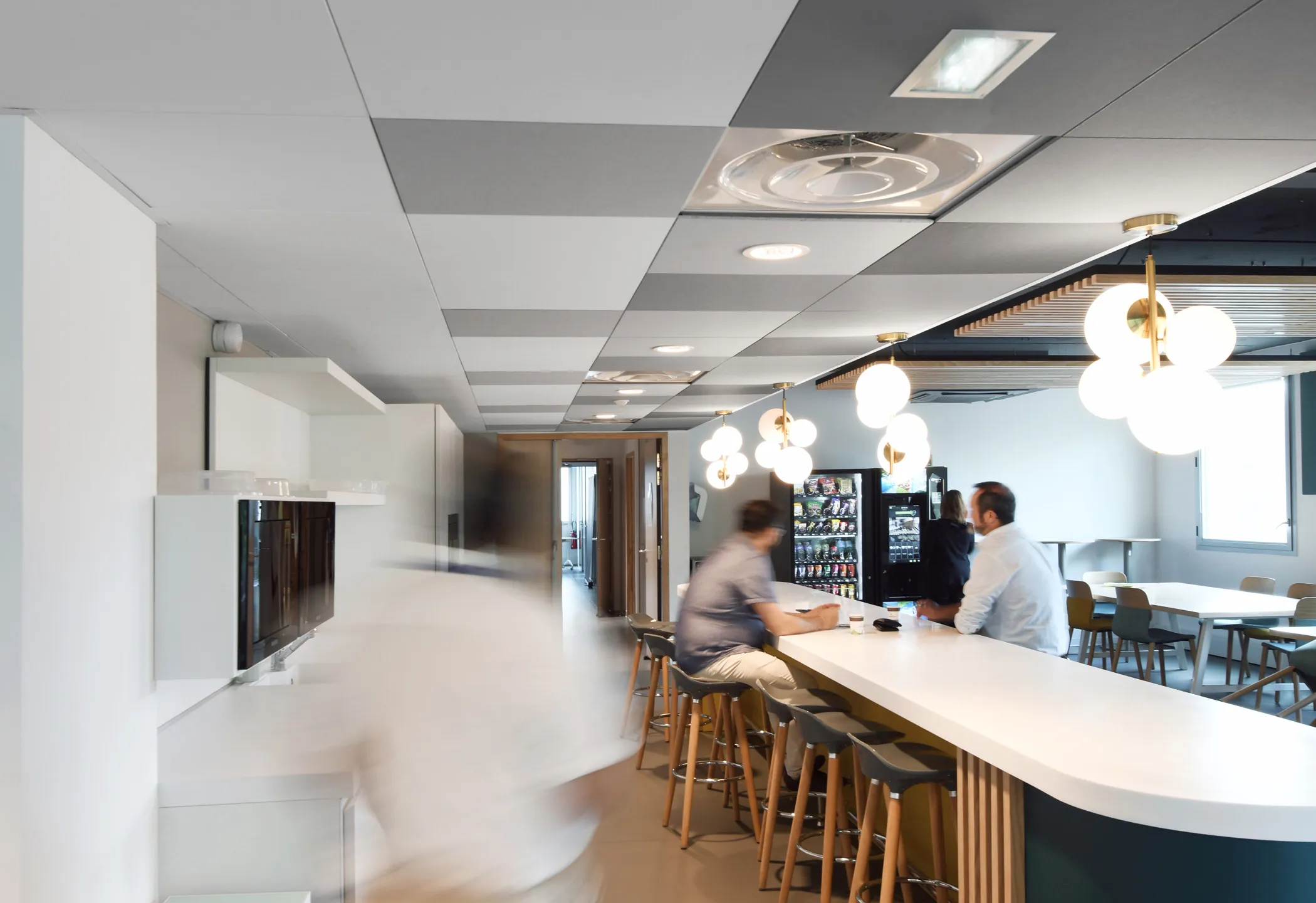 Restaurant with grey checkered ceiling design