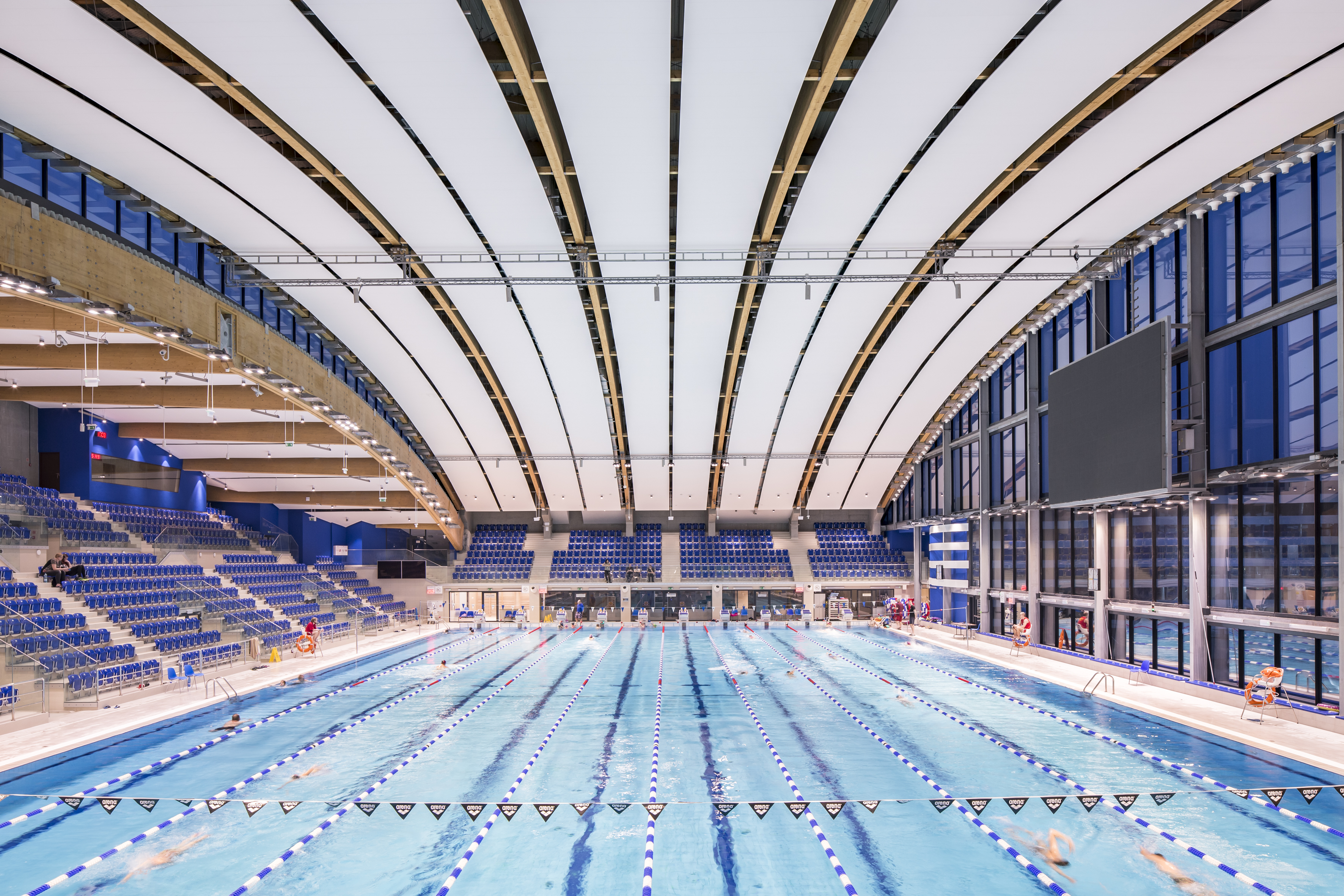 olympic swimming pool ceiling with Rockfon sonar acoustic white tiles