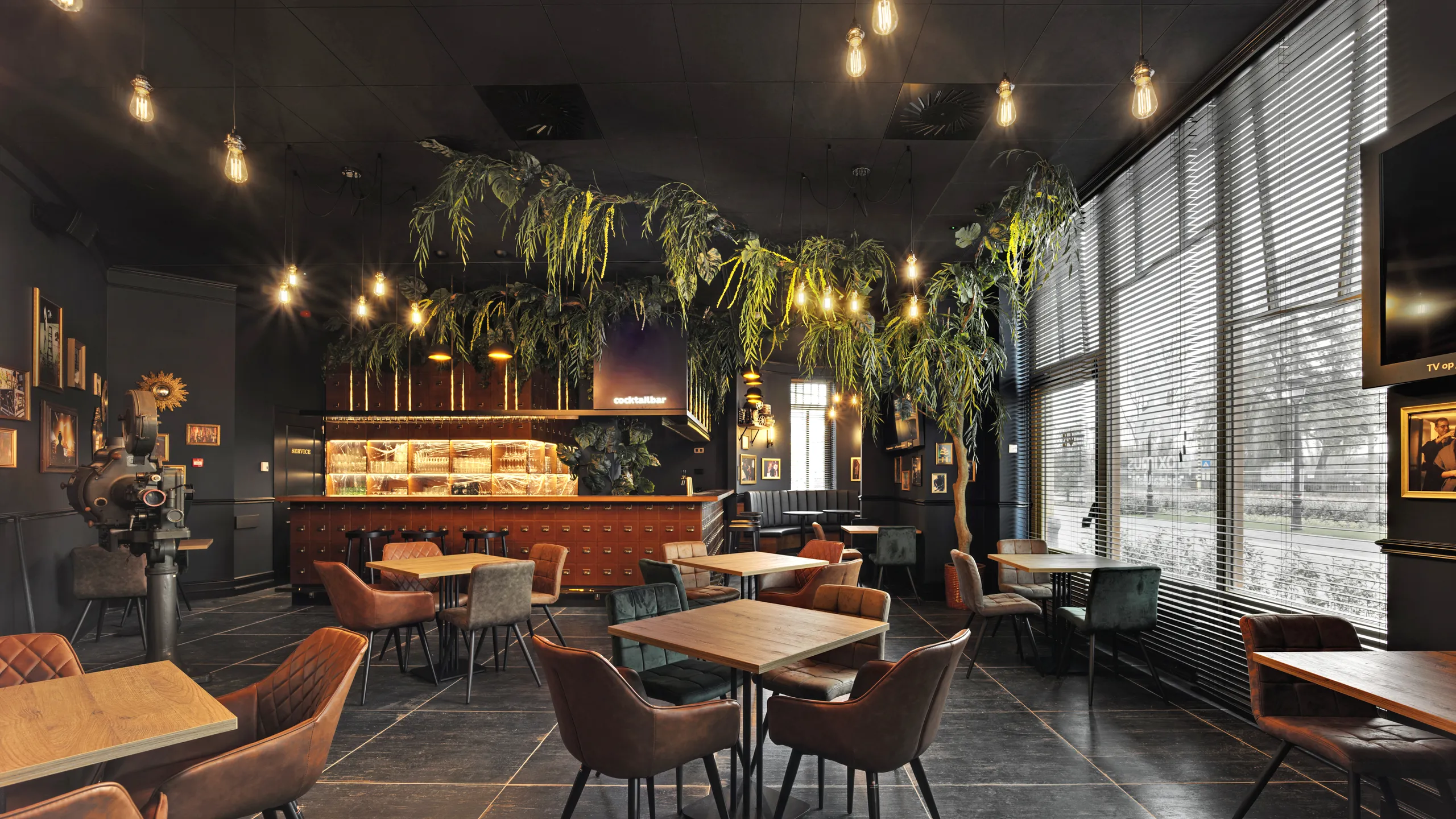 Charcoal ceiling design with Rockfon Color-all in a restaurant