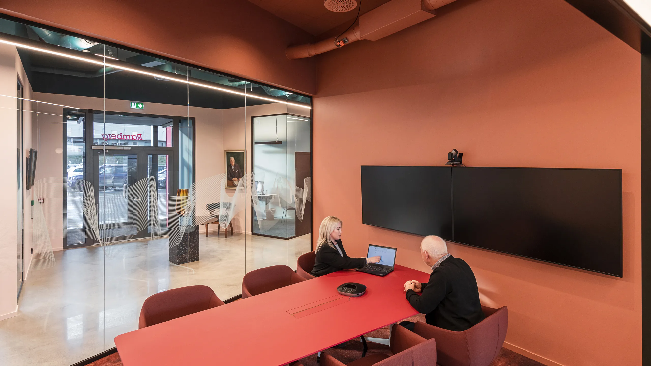 Meeting room in Ramberg Office with Rockfon Color-all salmon pink meeting room ceiling design